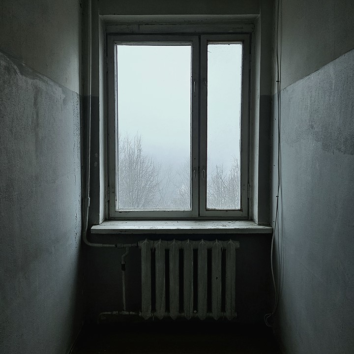 Black and white photo of window with fog